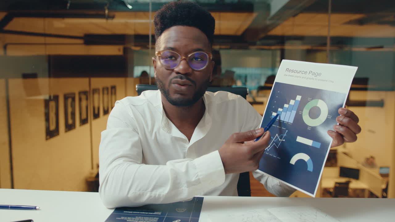 Black Businessman Explaining Financial Report during Online Meeting