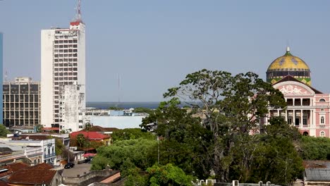 Establishing-shot-of-the-Manaus,-Brazil-city-center-with-the-Amazon-River-and-rainforest-along-the-horizon