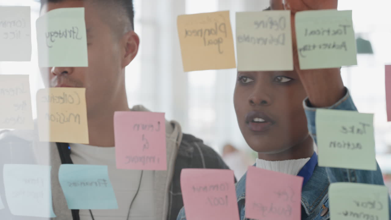 creative business team using sticky notes brainstorming colleagues working together problem solving discussing solution enjoying teamwork in startup office