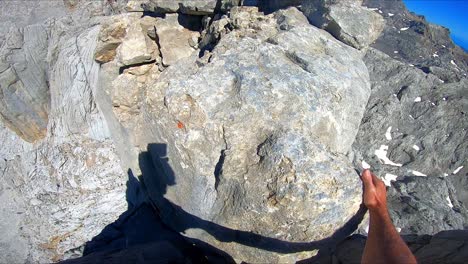 a climber walking along a very high ridge in peaks of europe