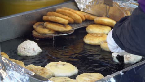 frying filled dough in a griddle with oil