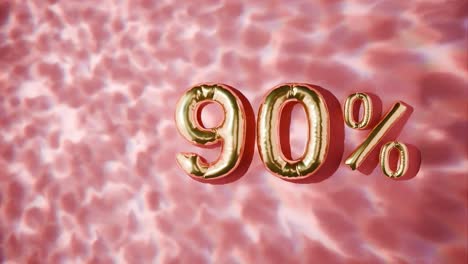 90% dorado flotando por encima de las ondas de agua en fondo rojo