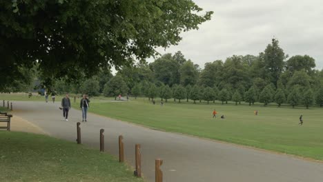 people social distancing in park enjoying the nature and fresh air.
