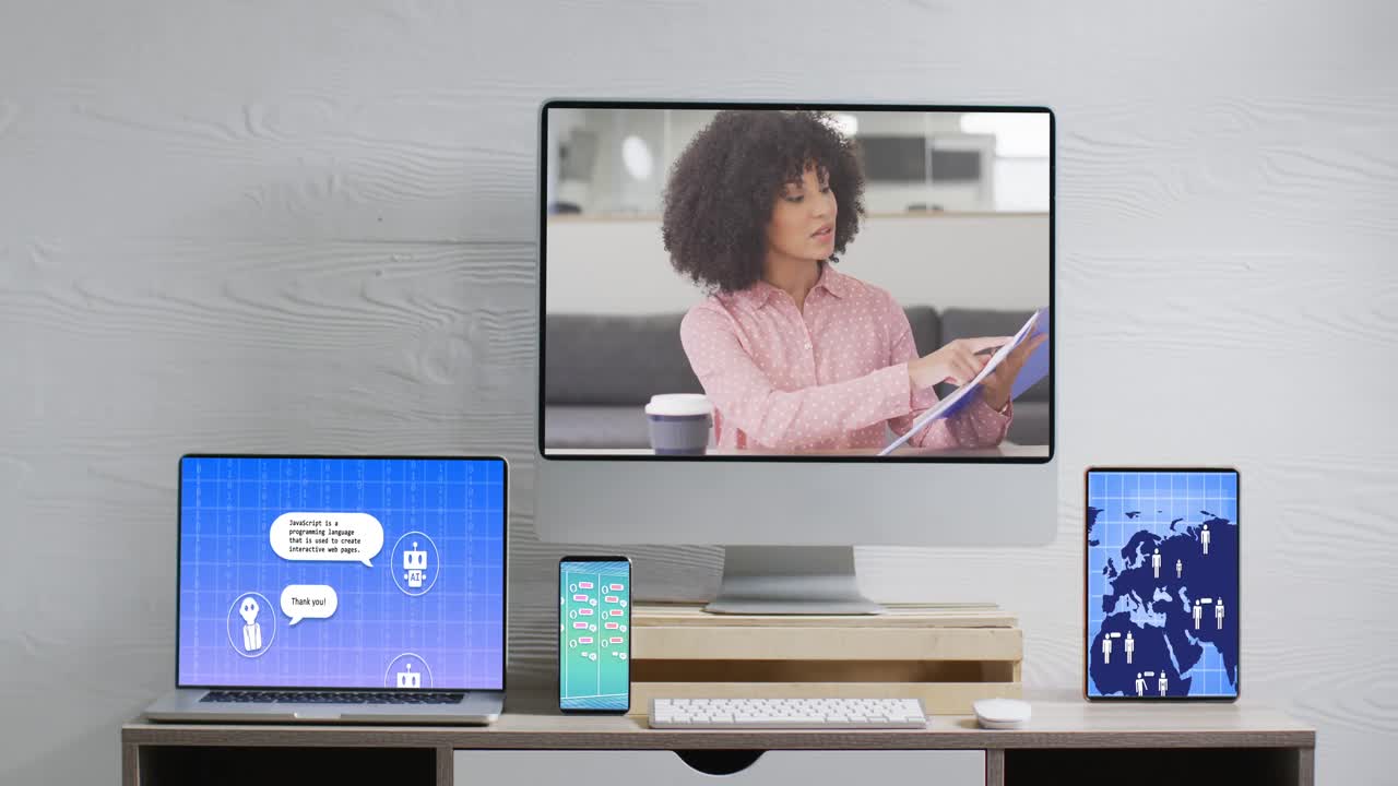 Biracial businesswoman on video call and electronic devices with network and ai messaging on screens