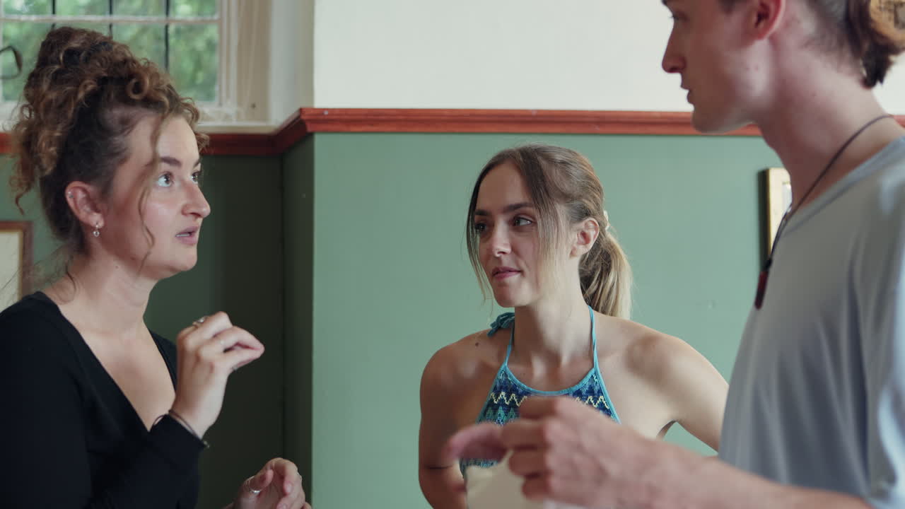 A group of friends conversing indoors