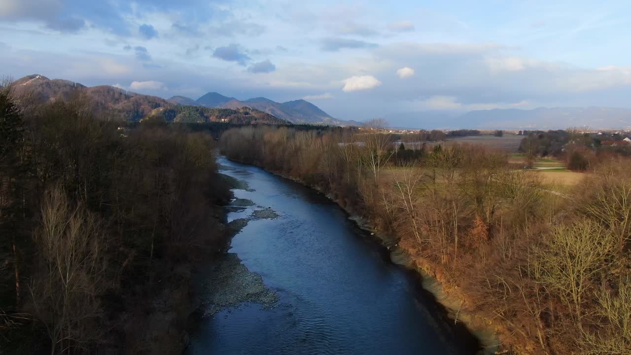 Savinja River near Vrbje Slovenia in the golden hour, Aerial flyover low shot