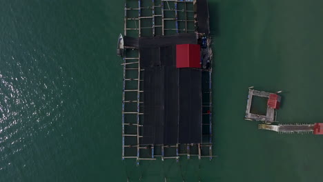 primitive fish farm cage system in tropical island of malaysia