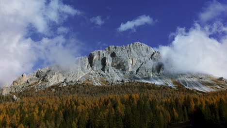 Clouds-dancing-above-South-Tyrol-woodland-mountains-summit-at-sunrise-time-lapse