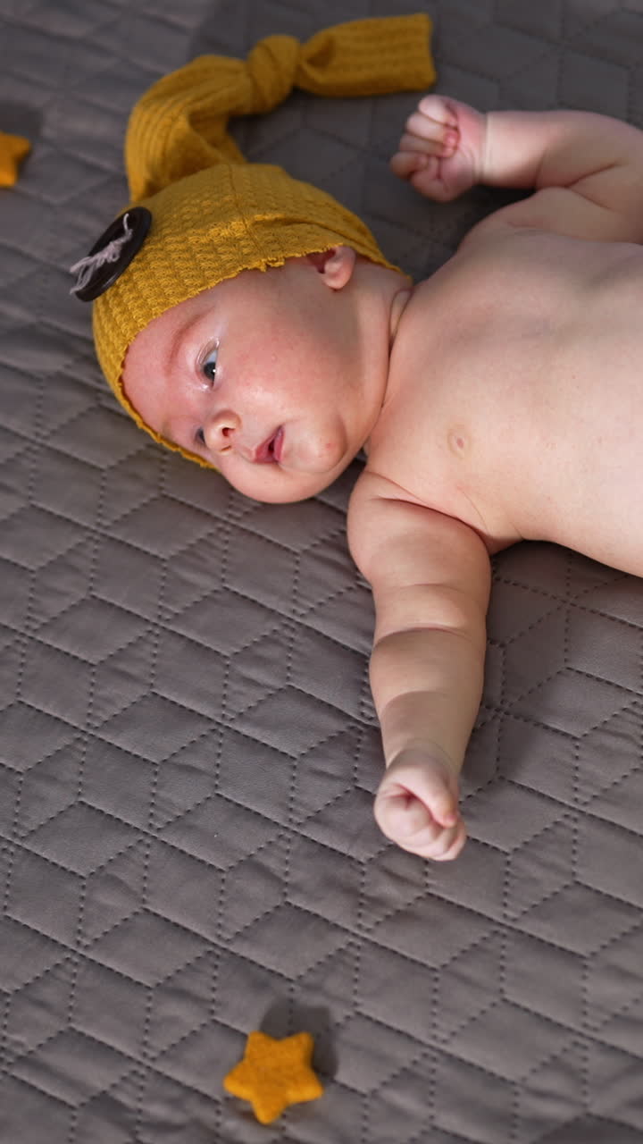 Adorable Newborn Baby in Yellow Hat