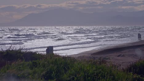 Ocean-waves,-single-person-staring-at-the-sea