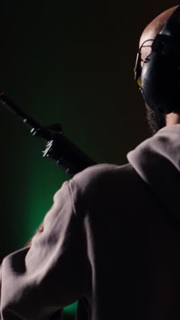 vertical video shooting range customer shooting targets with semiautomatic weapon