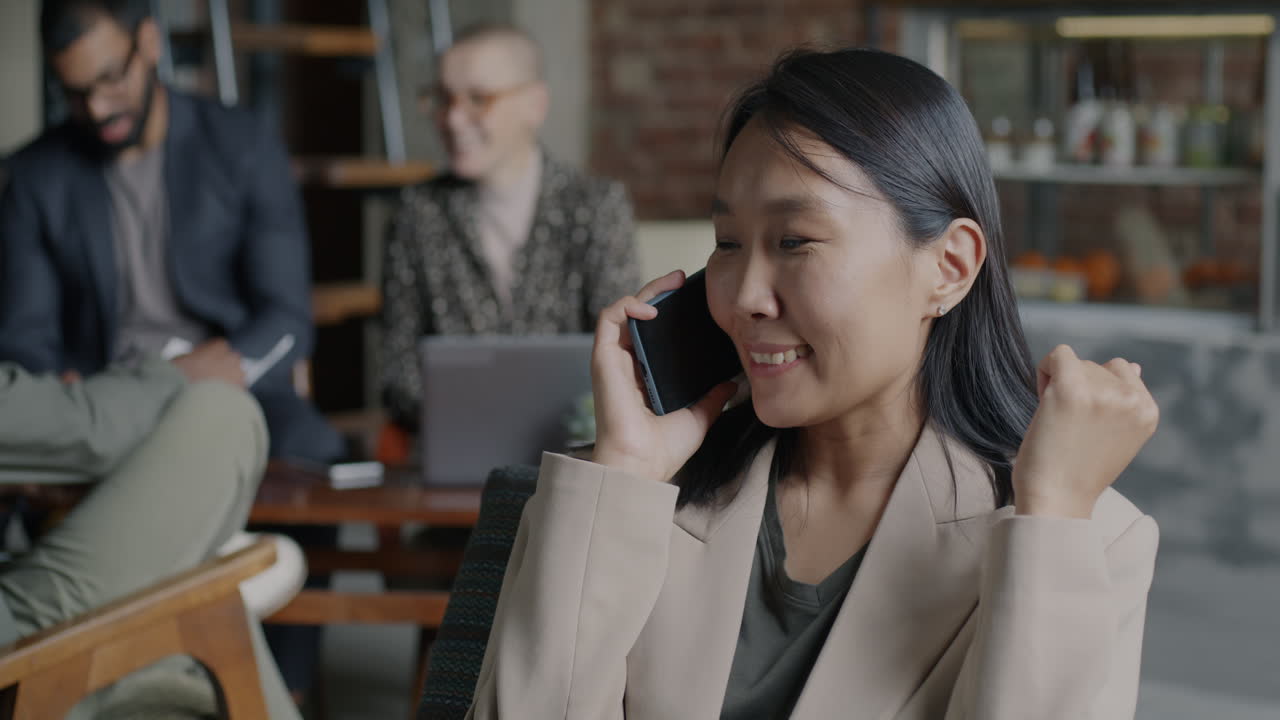 Woman on Phone in Modern Office