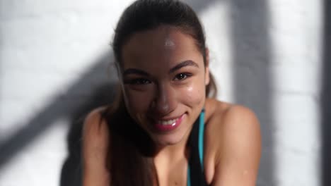 smiling woman in sports bra