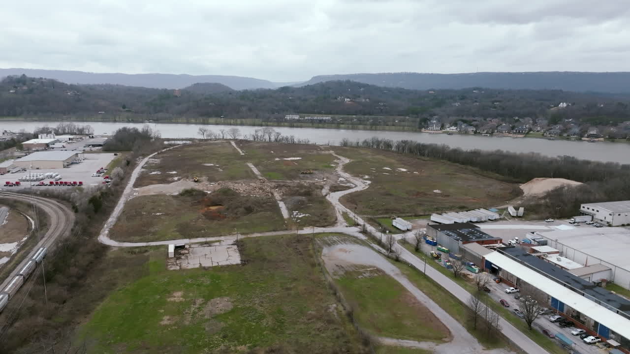 Wide aerial footage of a EPA superfund site in Chattanooga, TN that is abandoned where the camera pans down.