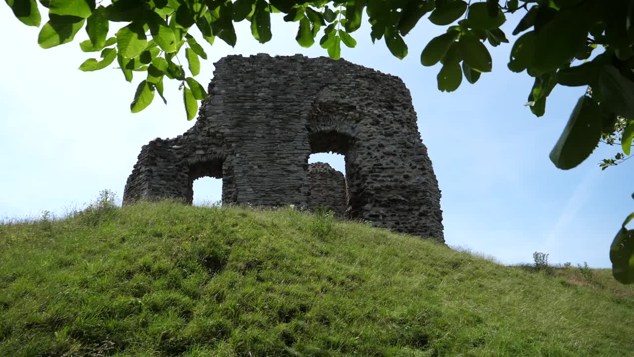 Passing an old castle ruins through the trees
