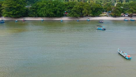 Establishing-aerial-view-of-fishing-boats-and-beach-on-Penang-Island-in-Malaysia