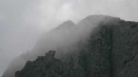 Huge-granite-walls-with-clouds-passing-by