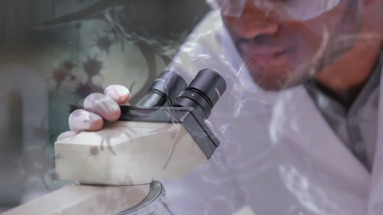 Animation of virus cells over biracial male scientist working in lab
