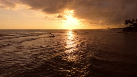 slow flight over beautiful caribbean sea along shoreline during golden sunset at horizon