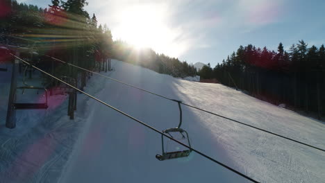 Picturesque-high-view-over-alpine-ski-trail-in-wintertime