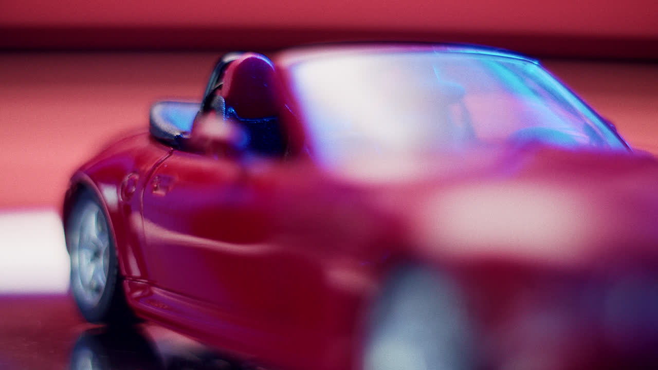 Red Toy Convertible Car with Abstract Lighting