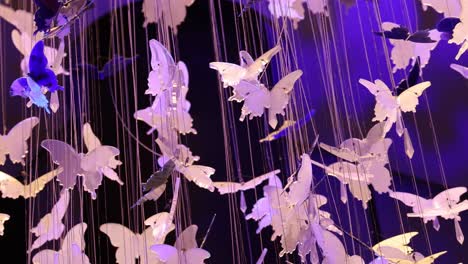 suspended paper butterflies gently moving