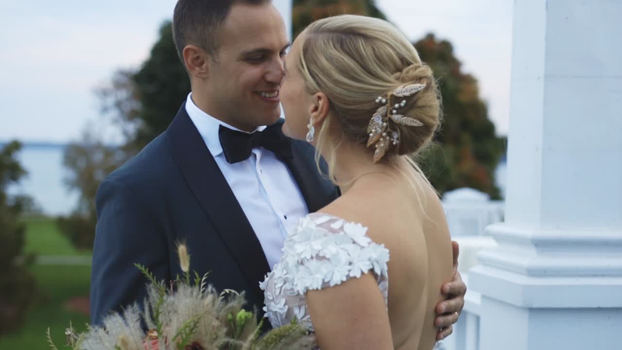 Bride and groom laugh romantically