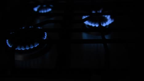 slide shot of burners of a stove being turned on