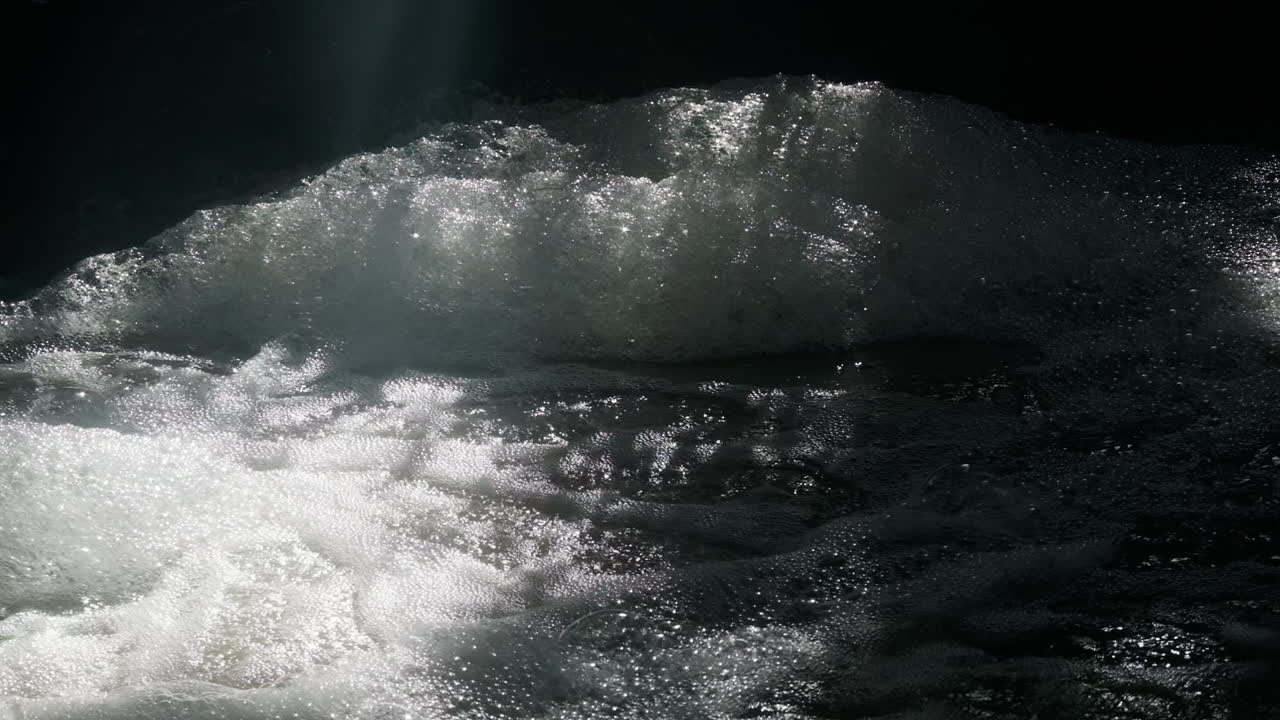 Bubbly water in a stream making massive piles of foam