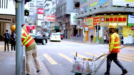 workers collaborate on street maintenance task