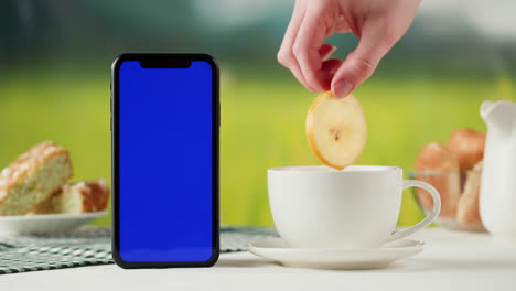 smartphone mockup on a table with coffee and pastries