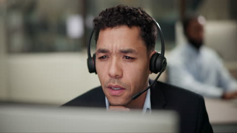 man wearing headset in office