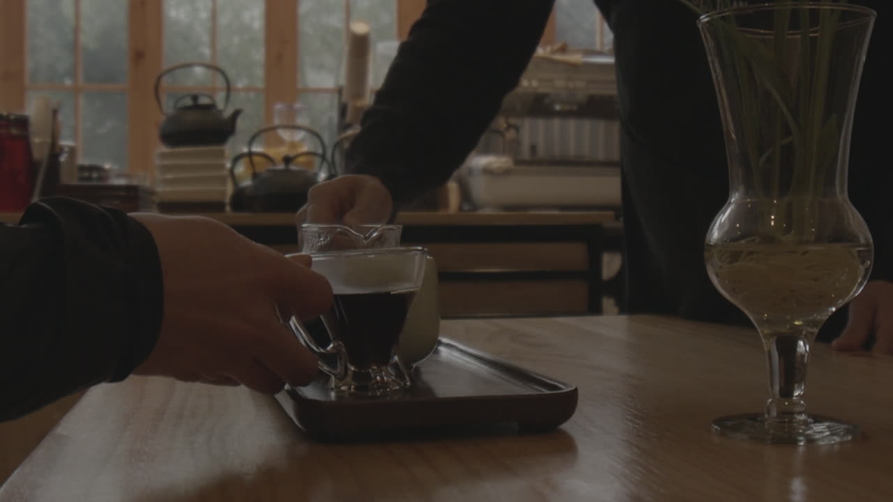 Man Pouring Tea In A Cup. Tea House Concept