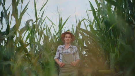 woman farmer standing in a cornfield