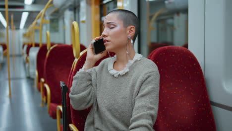 woman talking on phone in subway