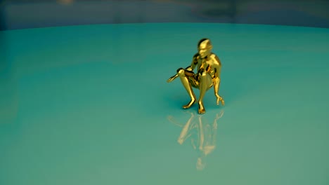 a golden human form performs a dance then deflates.