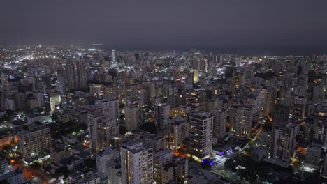 Vista-Aérea-Nocturna-Del-Horizonte-Iluminado-De-Santo-Domingo,-República-Dominicana