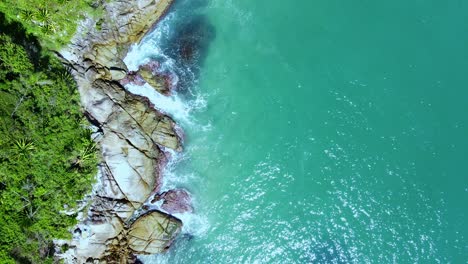 Aerial-Top-View-of-Ocean-Waves-Reaching-Beach-Shore