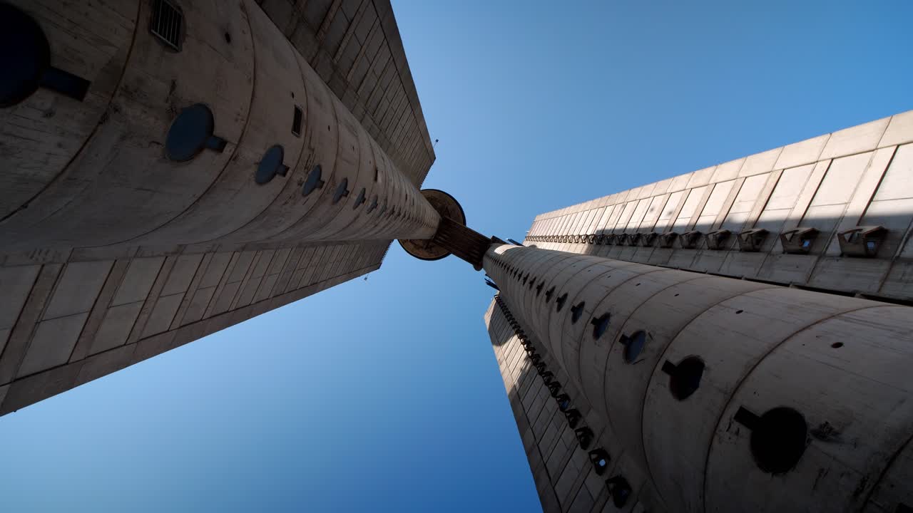 View of Belgrade’s Genex Tower, Serbia, showcasing brutalist architecture low angle drone view