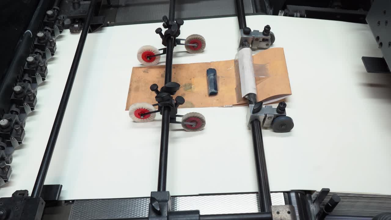 Industrial printer in action, feeding sheets at high speed