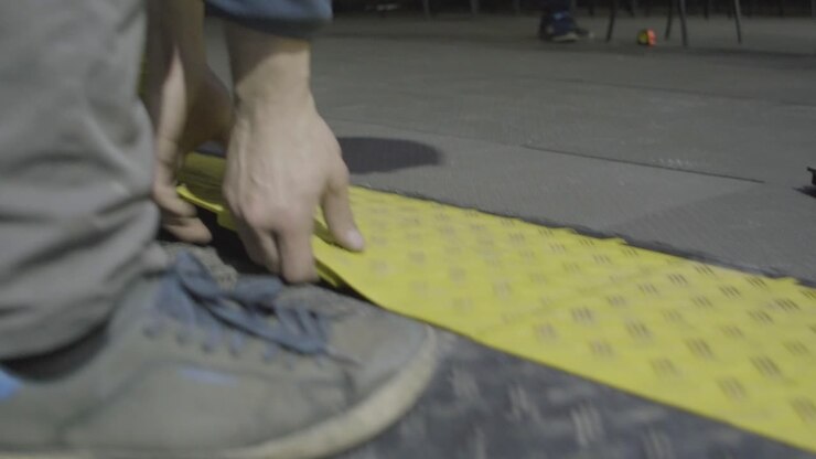 Installing Yellow Plastic Floor Tiles