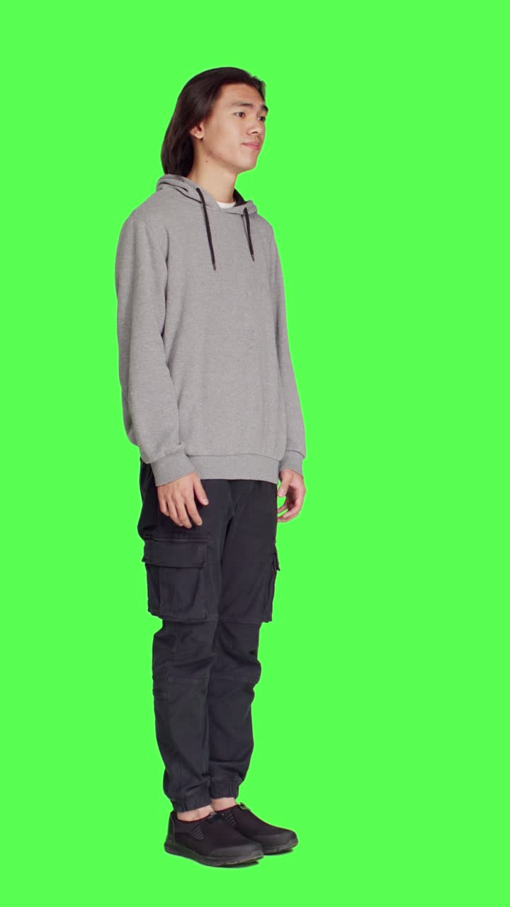 Side view of young model doing no sign on camera