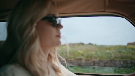 woman tourist riding car stretch hand in open window close up. driver travelling