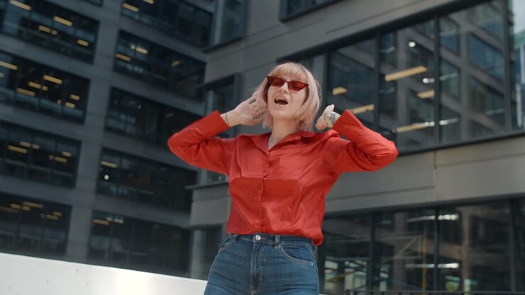 Happy Woman Dancing in the City