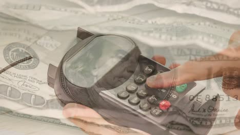 animation of dollar banknotes falling over hand of caucasian man holding payment terminal