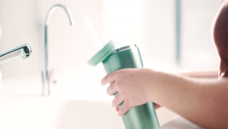 hands, water and bottle for hydration