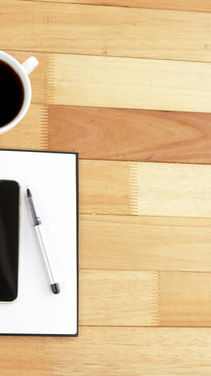 Digital tablet, coffee, spectacles, diary, mobile phone, pen and sticky notes