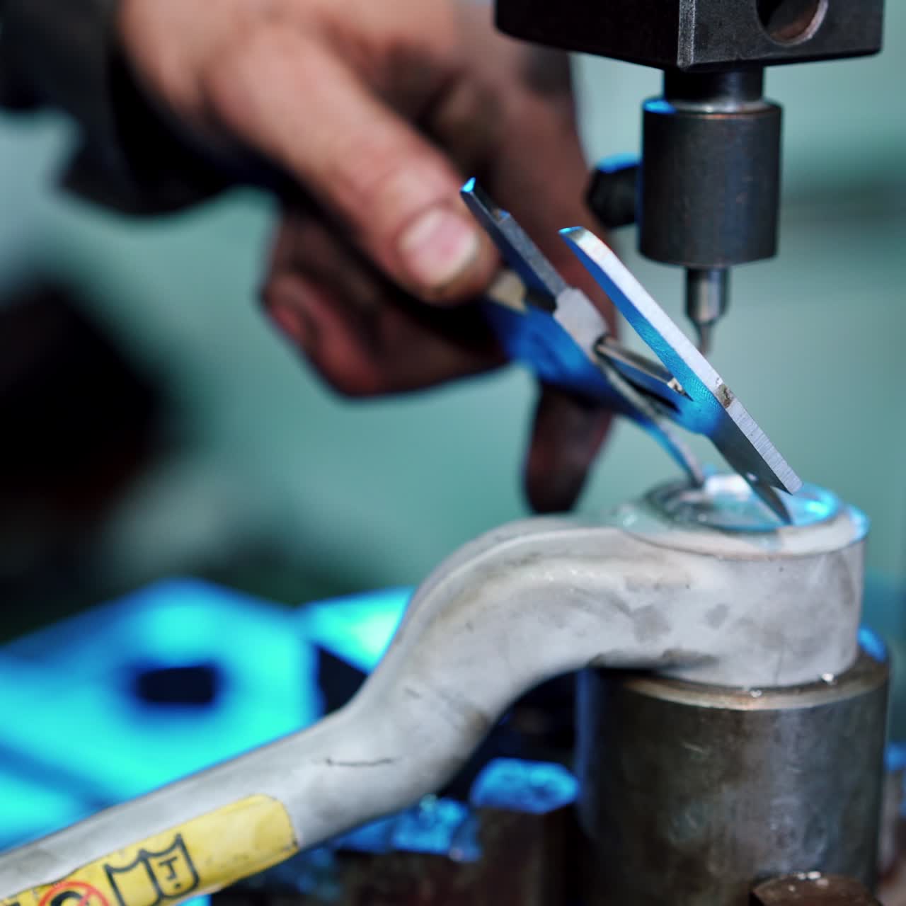 Worker using vernier calipers