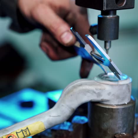 worker using vernier calipers