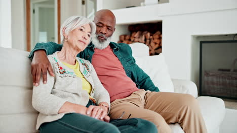 hugging, discussion and senior couple in living